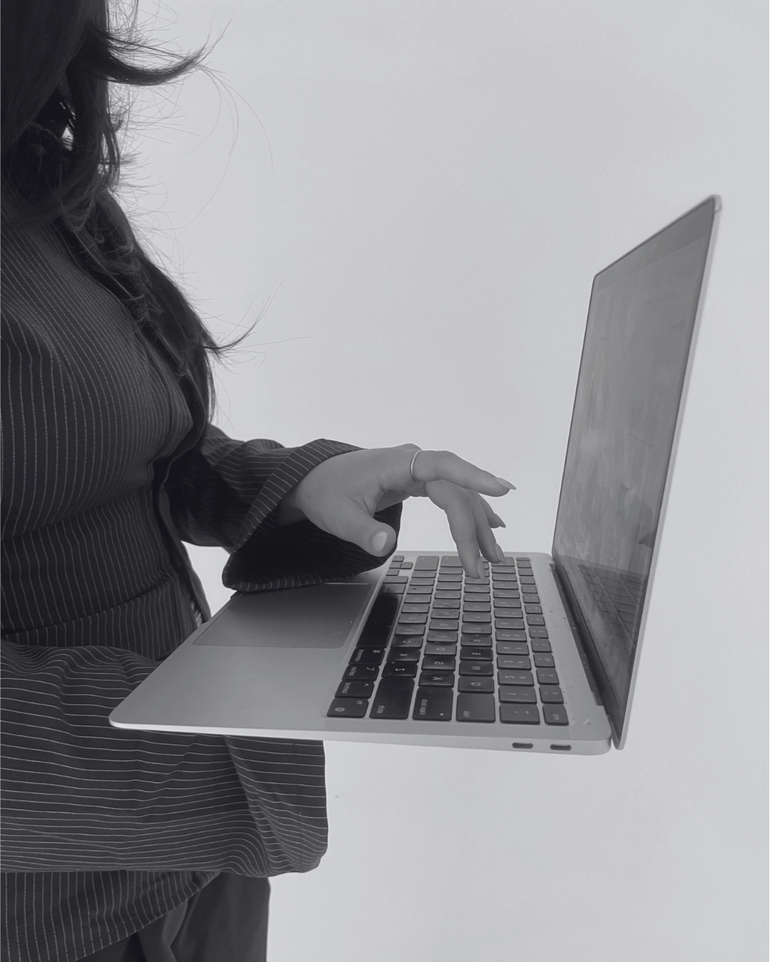 Person holding a laptop